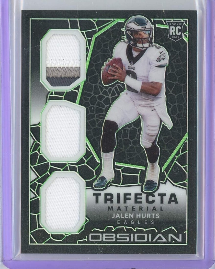 2020 Jalen Hurts Obsidian Trifecta Rookie Patch #TM22 /50 Authenticated: 2020 Jalen Hurts Obsidian Trifecta Rookie Patch #TM22 /50 Authenticated This 2020 Obsidian Trifecta Material Jalen Hurts #TM22 /50 Rookie Patch is a must-have for any NFL fan. Featuring a stunning pat