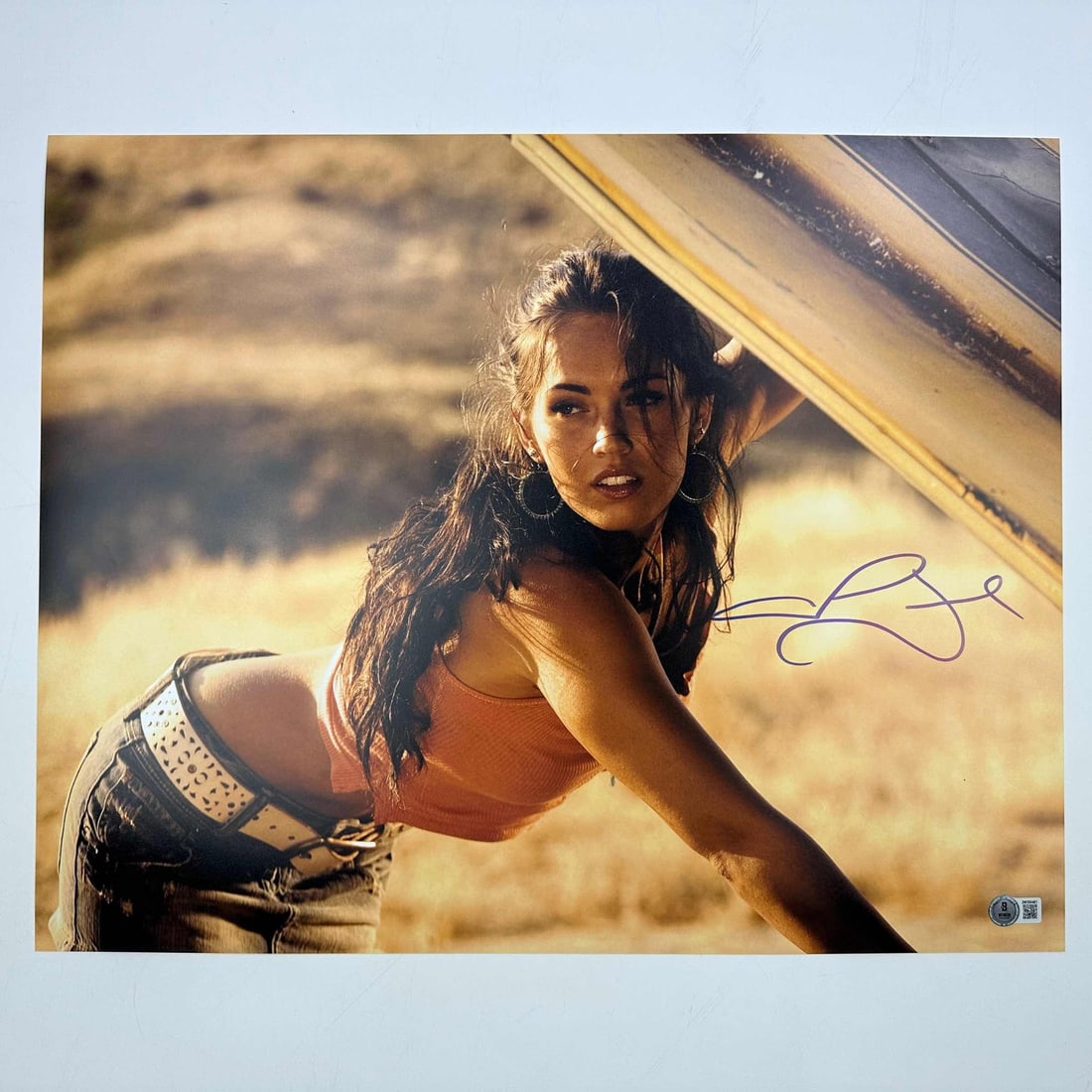 Megan Fox Signed 16x20 Transformers Photo Beckett BAS COA: Megan Fox Signed 16x20 Transformers Photo Beckett BAS COA This striking 16x20 photo features Megan Fox as Mikaela from the Transformers franchise, personally autographed by the actress herself. The au