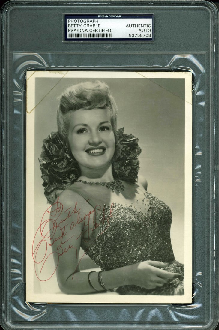 Betty Grable Signed 5x7 Photo To Ruth Best Always PSA/DNA: Betty Grable Signed 5x7 Photo To Ruth Best Always PSA/DNA This authentic 5x7 photo features the signature of Betty Grable, inscribed with "To Ruth - Best Always." The photo has been personally signed