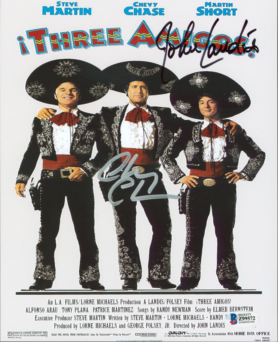 Three Amigos! Signed Photo by Chevy Chase & John Landis BAS Certified: Three Amigos! Signed Photo by Chevy Chase & John Landis BAS Certified This authentic 8x10 photograph features the signatures of Chevy Chase and John Landis from the classic film 'Three Amigos!'. The i