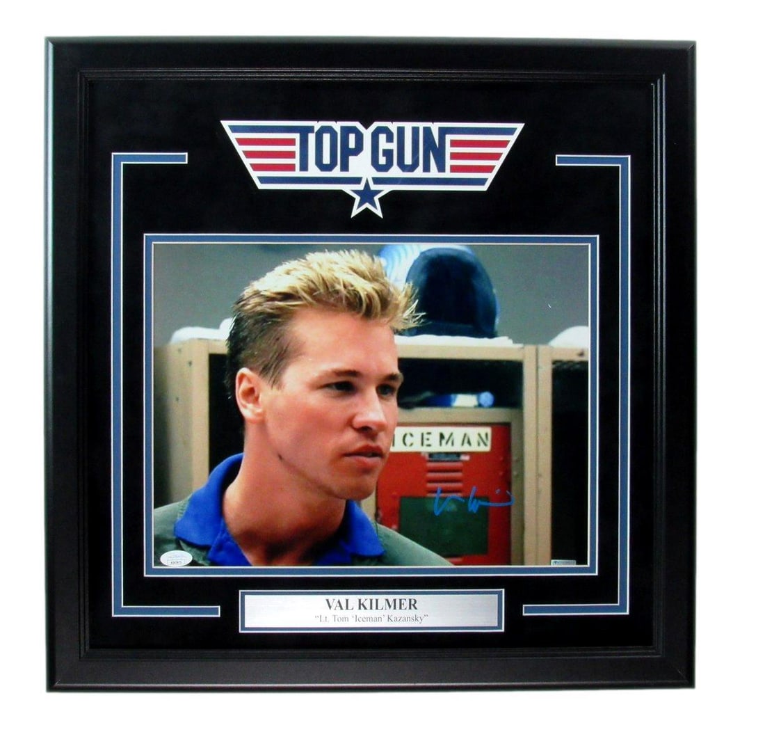 Val Kilmer Signed 11x14 Top Gun Photo Framed with JSA Authentication: Val Kilmer Signed 11x14 Top Gun Photo Framed with JSA Authentication This stunning 11x14 photograph of Val Kilmer from the iconic movie "Top Gun" features a bold signature, making it a must-have for a