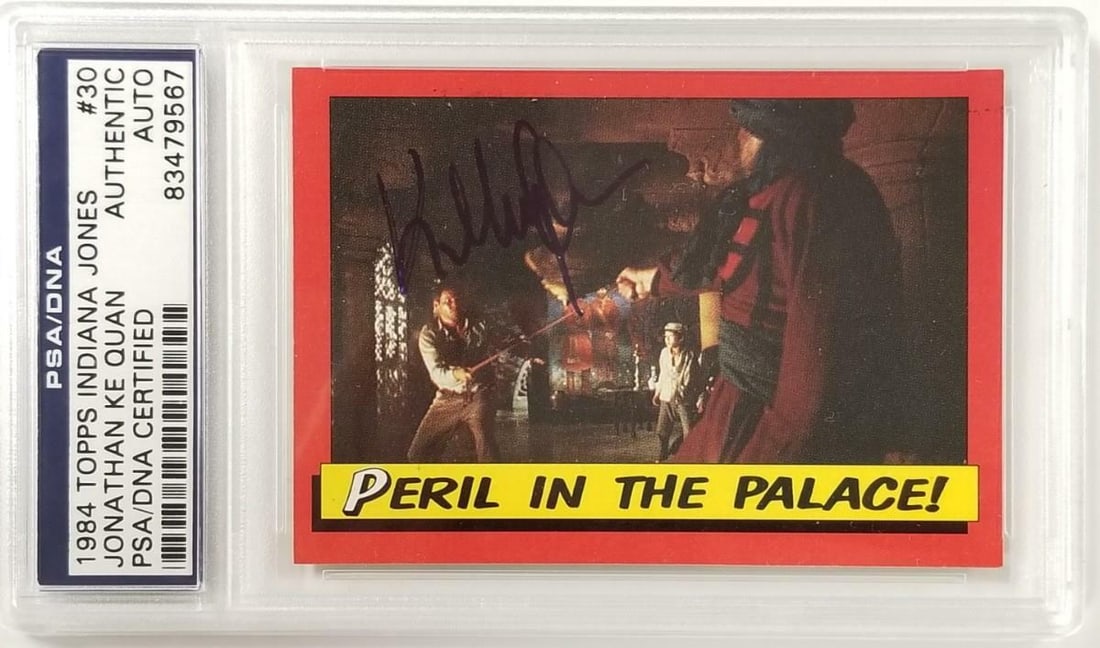 Jonathan Ke Quan Signed 1984 Topps Indiana Jones #30 PSA Authenticated: Jonathan Ke Quan Signed 1984 Topps Indiana Jones #30 PSA Authenticated This is a signed 1984 Topps Indiana Jones #30 Peril in Palace card, featuring the autograph of Jonathan Ke Quan, known for his