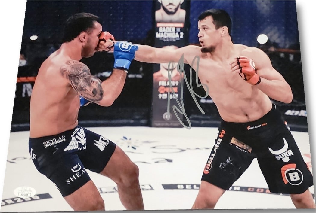Usamn Nurmagomedov Autographed 11x14 Photo Bellator MMA JSA COA: Usamn Nurmagomedov Autographed 11x14 Photo Bellator MMA JSA COA This is an original 11x14 photograph of Usamn Nurmagomedov, signed and authenticated by James Spence Authentication (JSA). The item feat