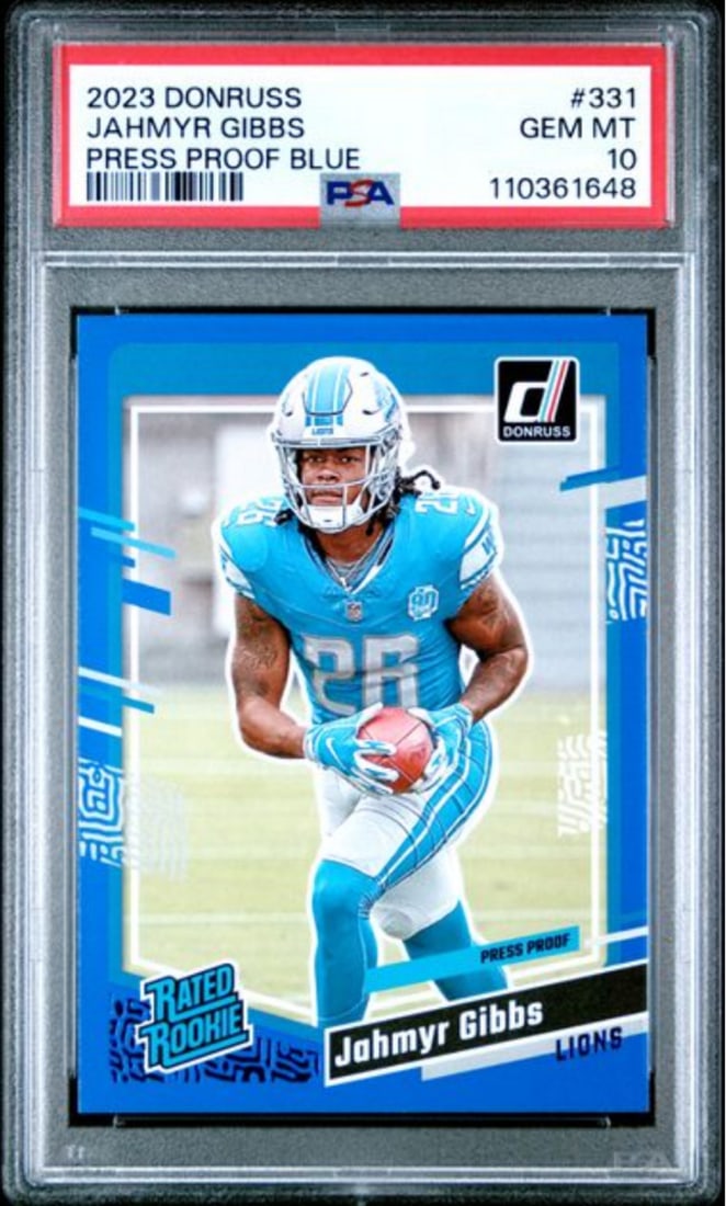 2023 Panini Donruss Jahmyr Gibbs #331 PSA 10 Blue Rookie Card: 2023 Panini Donruss Jahmyr Gibbs #331 PSA 10 Blue Rookie Card This is a Graded 2023 Panini Donruss Jahmyr Gibbs #331 Press Proof Blue Rookie Card, graded PSA 10. The card features Jahmyr Gibbs, a play