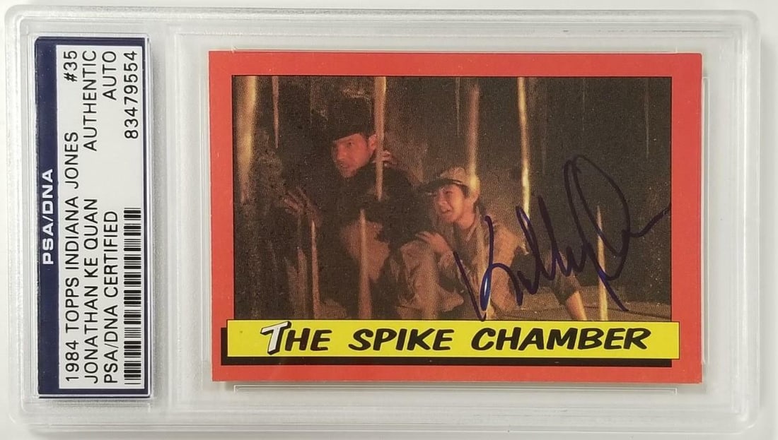 Jonathan Ke Quan Signed 1984 Topps Indiana Jones Card PSA Authenticated: Jonathan Ke Quan Signed 1984 Topps Indiana Jones Card PSA Authenticated This is a signed 1984 Topps Indiana Jones #35 Spike Chamber Card, featuring the autograph of Jonathan Ke Quan. This original car