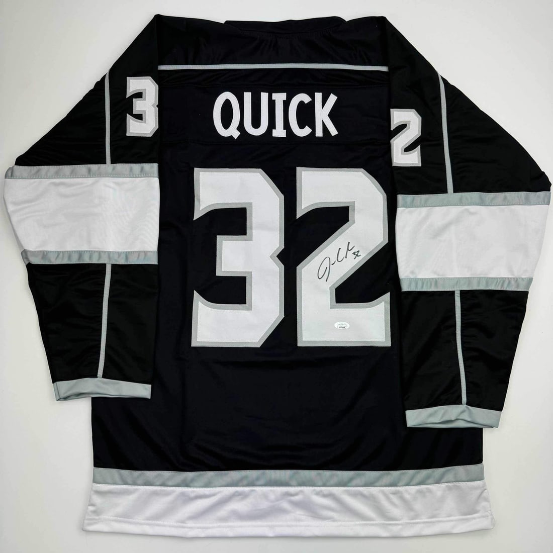 Autographed Jonathan Quick Los Angeles Kings Black Jersey JSA COA: Autographed Jonathan Quick Los Angeles Kings Black Jersey JSA COA This autographed Jonathan Quick Los Angeles Kings black hockey jersey is a unique collectible for fans and memorabilia enthusiasts. Fe