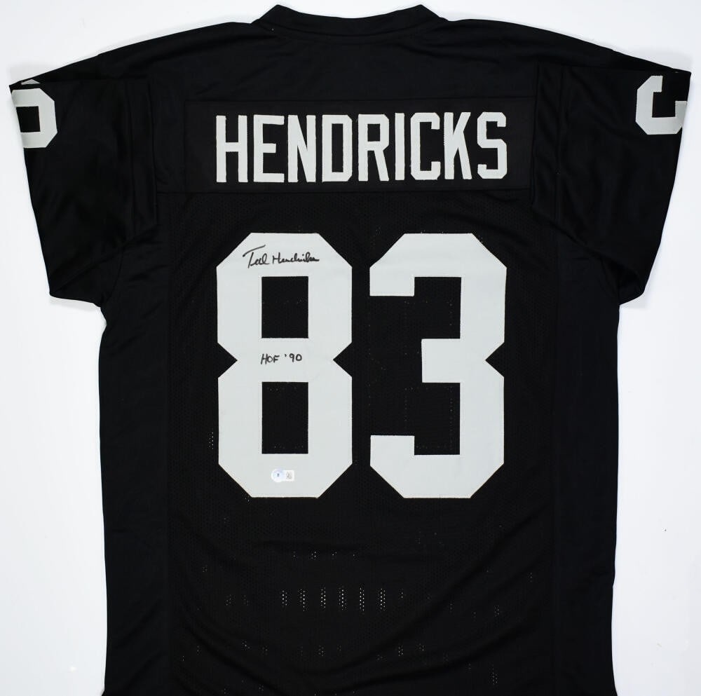 Ted Hendricks Signed Black Pro Style Jersey HOF Beckett Authenticated: Ted Hendricks Signed Black Pro Style Jersey HOF Beckett Authenticated This is an original autographed black pro style jersey of Ted Hendricks, a legendary player from the Los Angeles Raiders. The