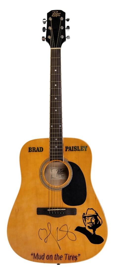 Brad Paisley Signed Rogue Guitar with PSA DNA COA: Brad Paisley Signed Rogue Guitar with PSA DNA COA This Rogue acoustic guitar is a unique piece signed by country music star Brad Paisley. His flowing signature is prominently displayed in black marker