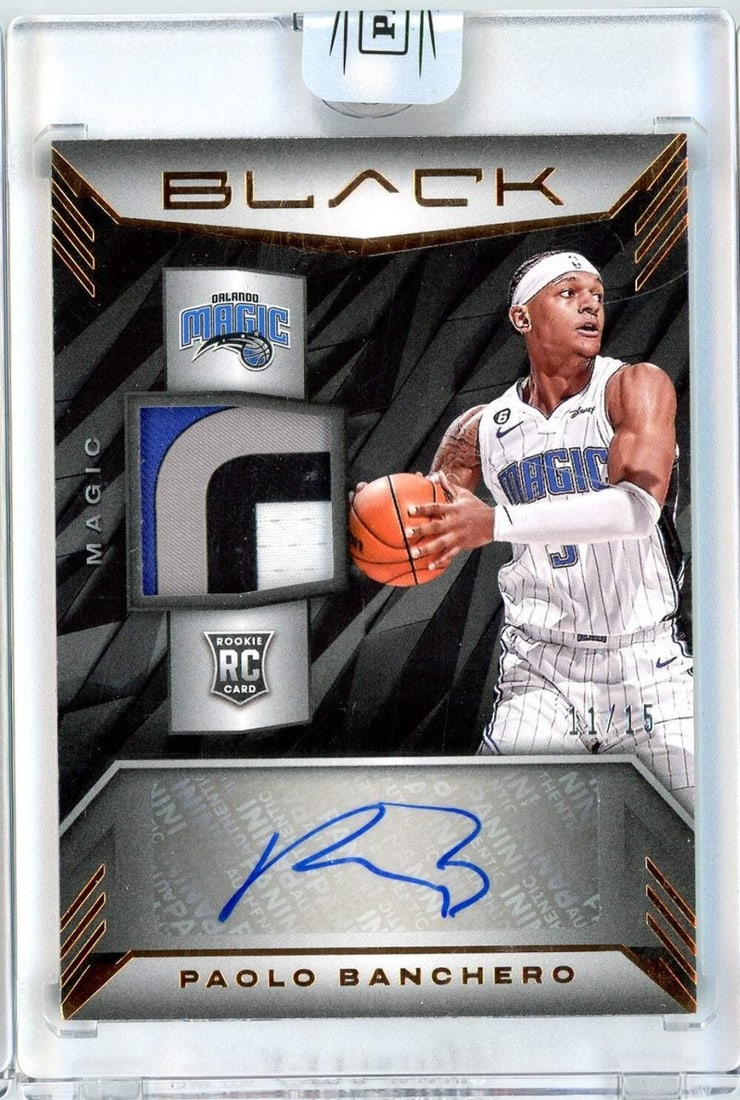 2022 Panini Black Paolo Banchero RPA #RMA-PBC /15 Autographed NBA Card: 2022 Panini Black Paolo Banchero RPA #RMA-PBC /15 Autographed NBA Card This 2022 Panini Black Paolo Banchero #RMA-PBC /15 RPA Basketball Card is a must-have for collectors and fans alike. Authenticate