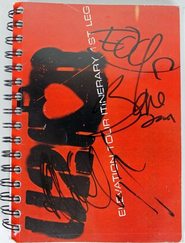 U2 Elevation Tour Book Signed by Bono The Edge Adam Clayton PSA Authenticated: U2 Elevation Tour Book Signed by Bono The Edge Adam Clayton PSA Authenticated This authentic U2 Band signed Elevation Tour Book features the signatures of iconic members Bono, The Edge, and Adam Clayt
