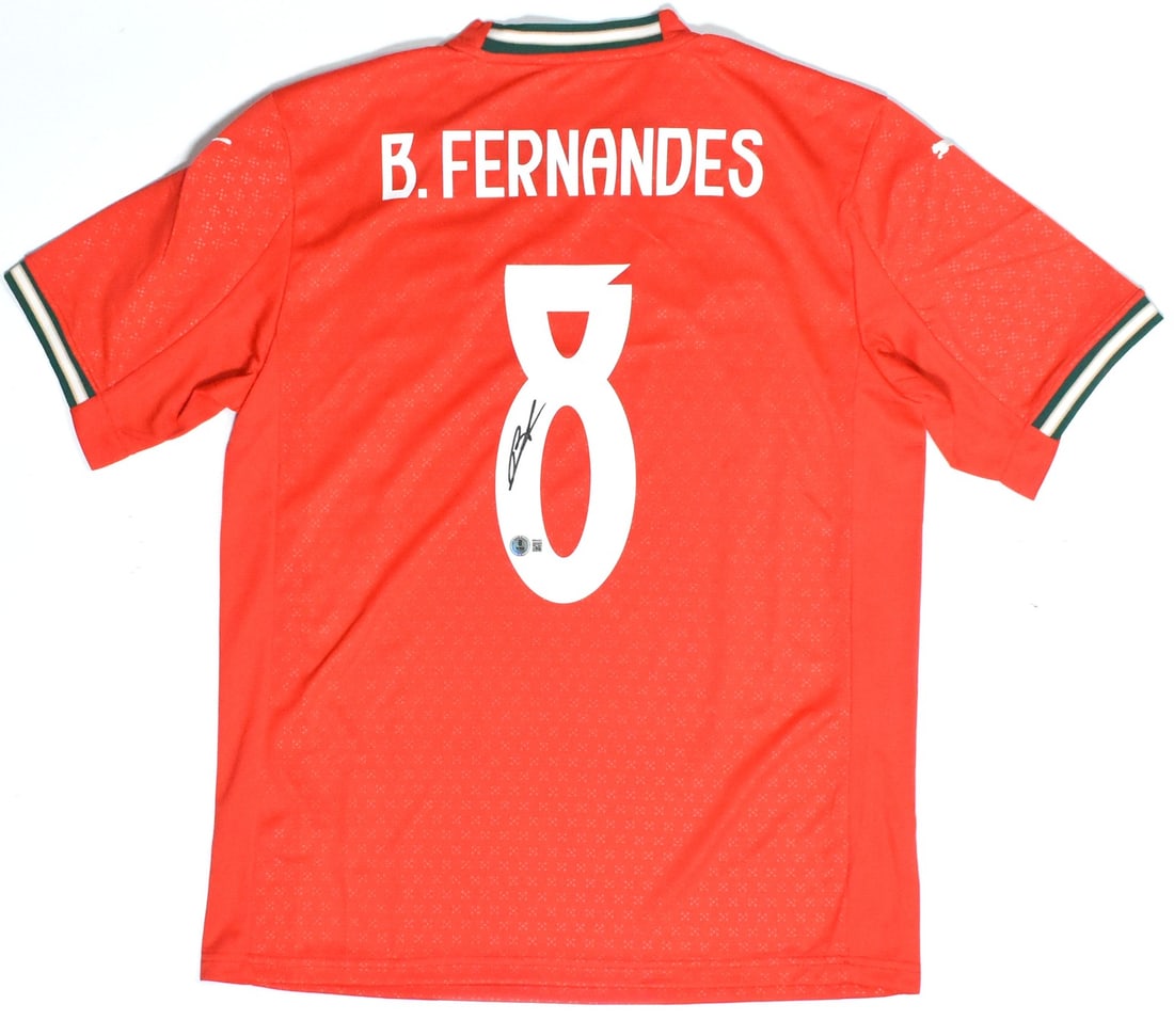 Portugal Home Jersey Signed by Bruno Fernandes with Beckett Hologram: Portugal Home Jersey Signed by Bruno Fernandes with Beckett Hologram This Portugal home soccer jersey features the autograph of Bruno Fernandes and displays his number 8. The jersey is an original ite