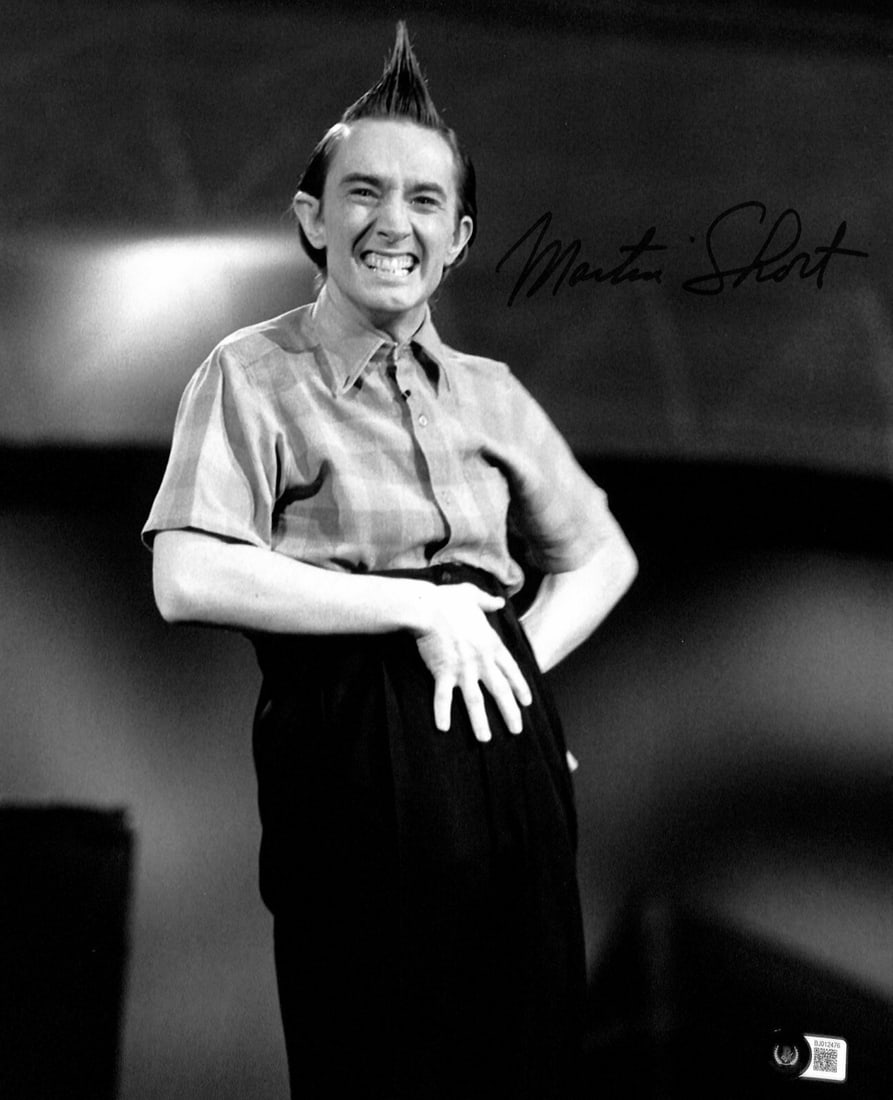 Martin Short Ed Grimley Signed 11x14 Photo Beckett Authenticated: Martin Short Ed Grimley Signed 11x14 Photo Beckett Authenticated This autographed 11x14 photograph features Martin Short as "Ed Grimley" from the iconic TV series SNL. The signature is rendered in bla