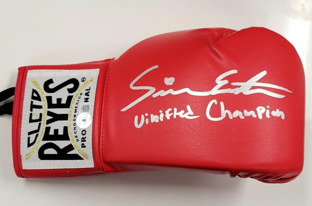Seniesa Estrada Signed Boxing Glove Unified Champion BAS Authenticated: Seniesa Estrada Signed Boxing Glove Unified Champion BAS Authenticated This is an original boxing glove signed by Seniesa Estrada, recognized as a "Unified Champion". The autograph is authenticated by