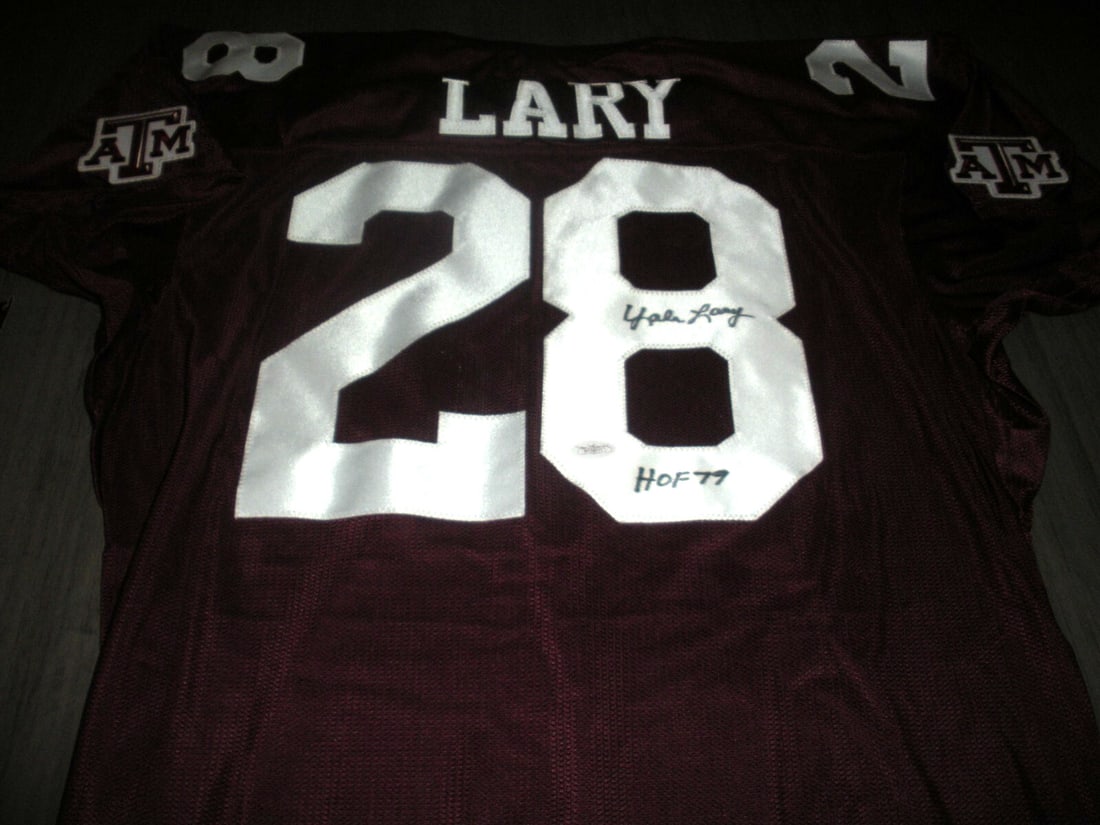 Yale Lary Signed Texas A&M Aggies Rawlings Jersey with JSA COA: Yale Lary Signed Texas A&M Aggies Rawlings Jersey with JSA COA This is a rare official licensed Rawlings jersey signed by Yale Lary, a former Texas A&M Aggies football player. The jersey is an origina