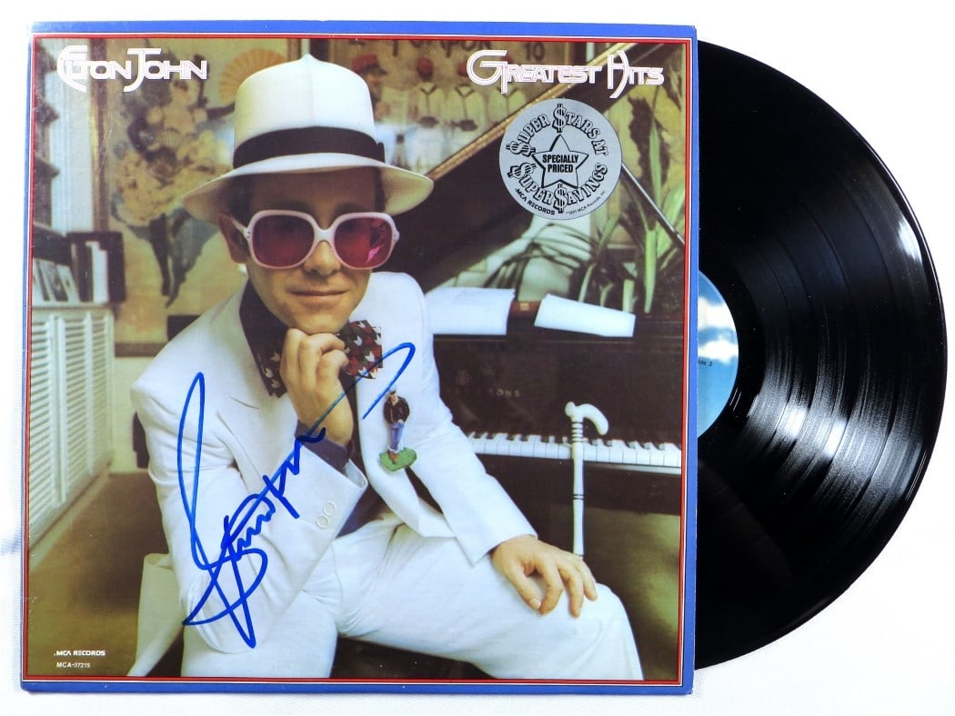 Bernie Taupin Signed Elton John Greatest Hits Album Cover JSA Authenticated: Bernie Taupin Signed Elton John Greatest Hits Album Cover JSA Authenticated This is a Bernie Taupin autographed album cover from Elton John's Greatest Hits. The album cover is an original piece, authe