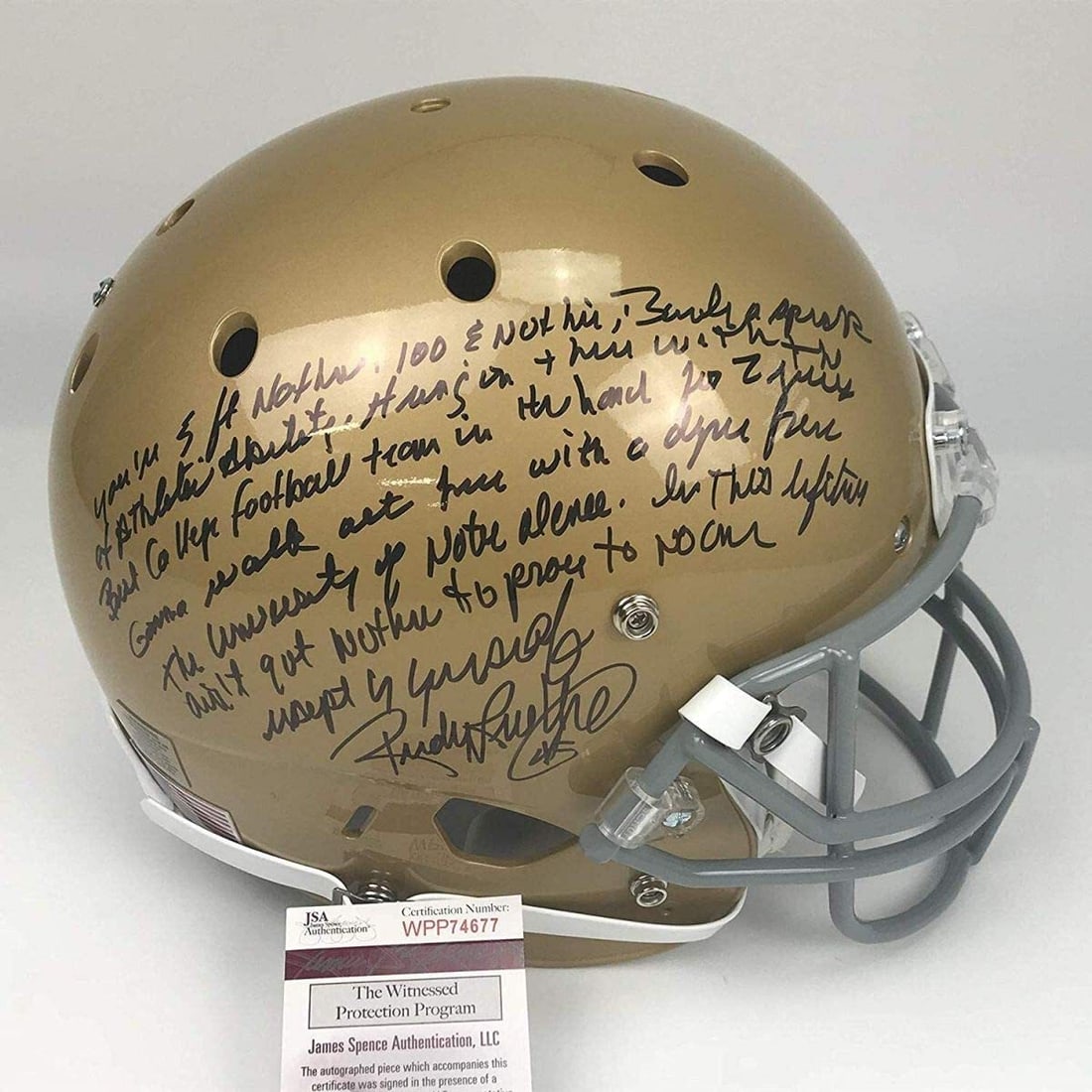 Rudy Ruettiger Autographed Full Size Notre Dame Helmet JSA COA: Rudy Ruettiger Autographed Full Size Notre Dame Helmet JSA COA This is an authentic full-size helmet signed by Rudy Ruettiger, a notable athlete known for his inspiring story at Notre Dame. The helmet