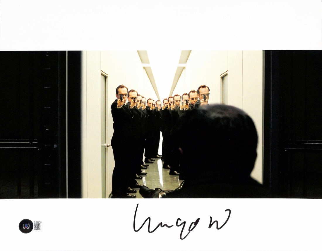 11x14 Photograph Signed by Hugo Weaving as Agent Smith Beckett Authenticated: 11x14 Photograph Signed by Hugo Weaving as Agent Smith Beckett Authenticated This is an original 11x14-inch photograph signed by Hugo Weaving, who portrayed Agent Smith in The Matrix. The autograph, s