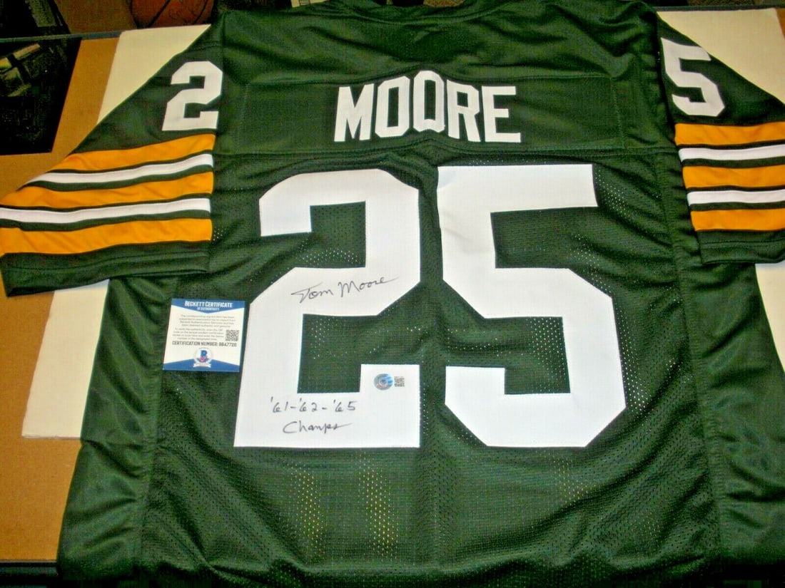 Tom Moore Green Bay Packers Signed Jersey 1961 1962 1965 Champs Beckett COA: Tom Moore Green Bay Packers Signed Jersey 1961 1962 1965 Champs Beckett COA This original signed jersey commemorates Tom Moore's achievements with the Green Bay Packers, celebrating their championship