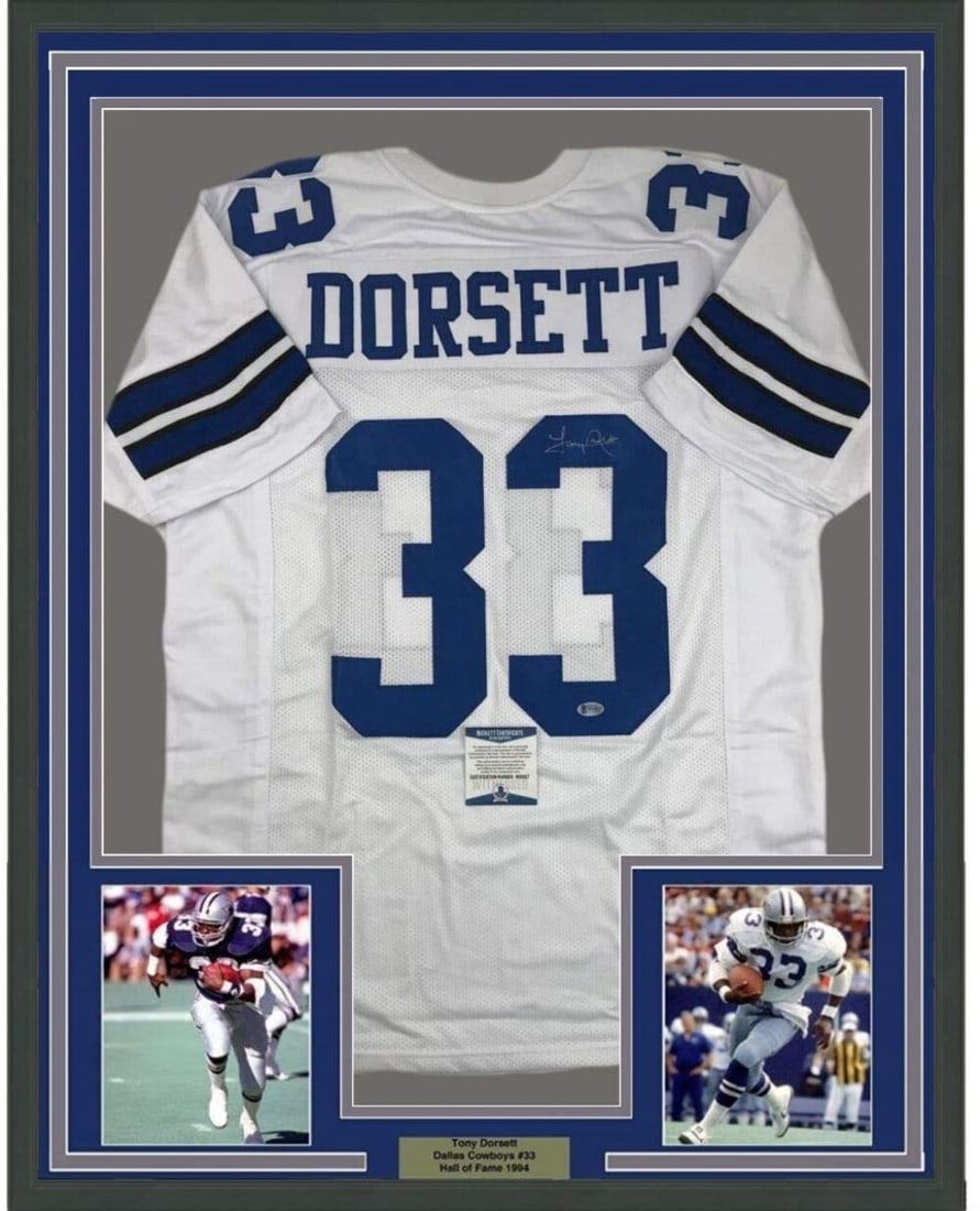 Tony Dorsett Signed Dallas Cowboys Jersey Framed 35x39 With Beckett COA: Tony Dorsett Signed Dallas Cowboys Jersey Framed 35x39 With Beckett COA This professionally framed and matted display features a Dallas Cowboys white jersey autographed by Tony Dorsett. The jersey is