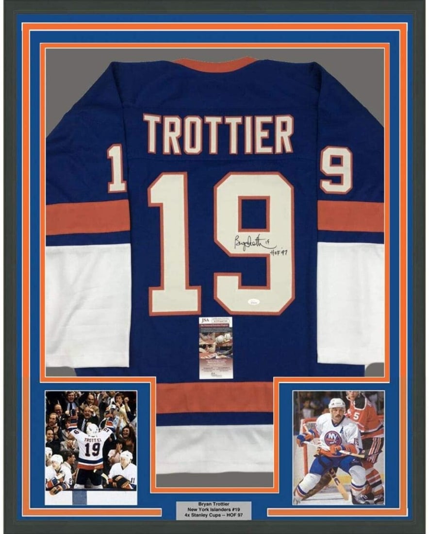 Framed Autographed Bryan Trottier Jersey HOF 97 JSA COA 33x42 NY Islanders: Framed Autographed Bryan Trottier Jersey HOF 97 JSA COA 33x42 NY Islanders Celebrate the legacy of Bryan Trottier with this professionally framed and autographed New York Islanders jersey. Measuring 3