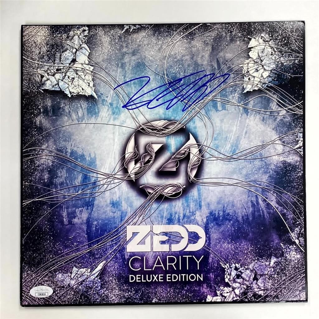 Zedd Clarity LP vinyl album hand signed with JSA authentication: Zedd Clarity LP vinyl album hand signed with JSA authentication This is an original Clarity vinyl record album LP hand signed by DJ Zedd. The autograph is authenticated by James Spence Authentication