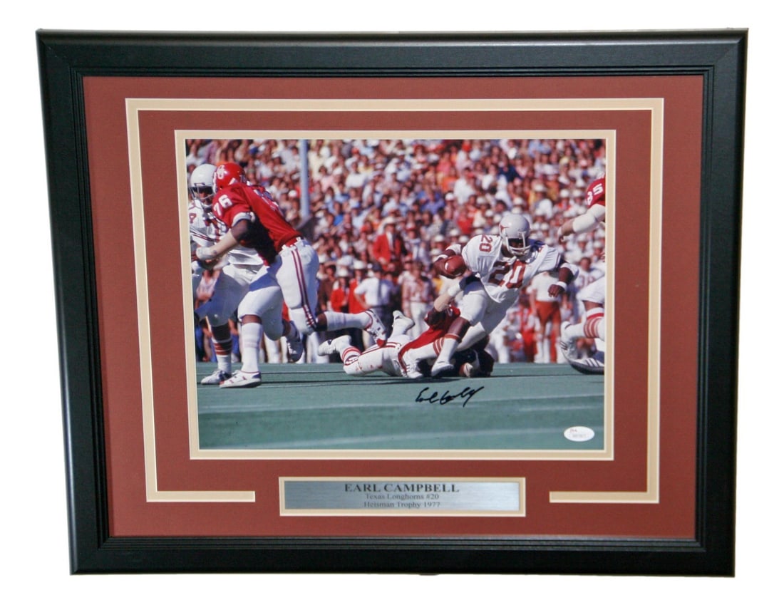 Earl Campbell Autographed Framed 11x14 Photo Texas Longhorns JSA Certified: Earl Campbell Autographed Framed 11x14 Photo Texas Longhorns JSA Certified This stunning 11x14 framed photo captures the legendary Earl Campbell in action as a Texas Longhorn. The photo is not only a