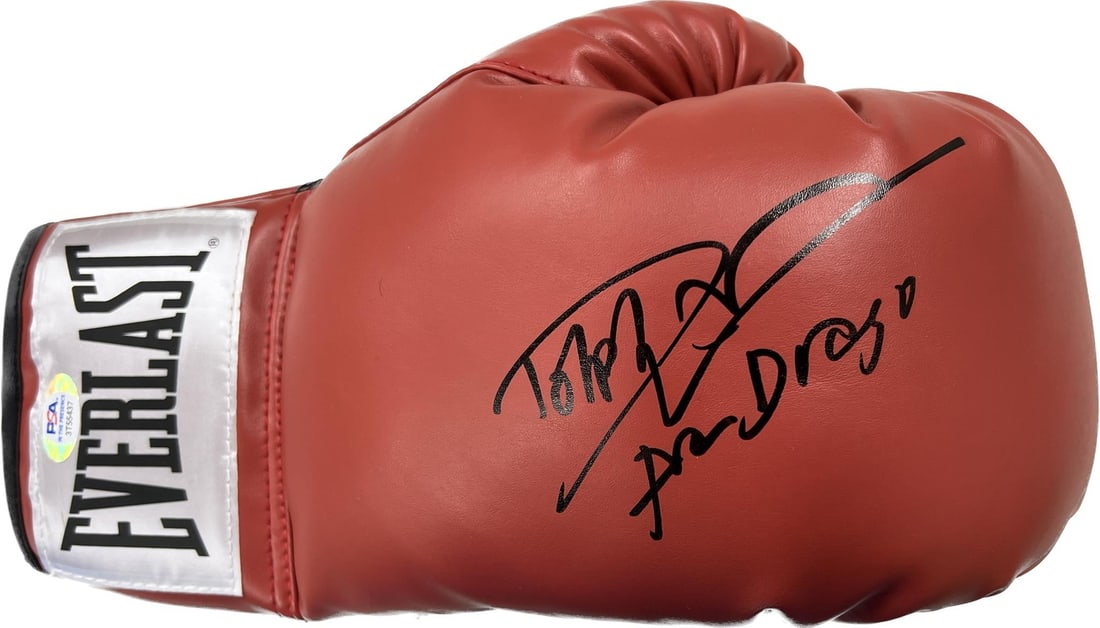Dolph Lundgren Signed Boxing Glove PSA/DNA Ivan Drago Rocky IV: Dolph Lundgren Signed Boxing Glove PSA/DNA Ivan Drago Rocky IV This is a boxing glove signed by Dolph Lundgren, known for his iconic role as Ivan Drago in the film Rocky IV. The autograph has been aut