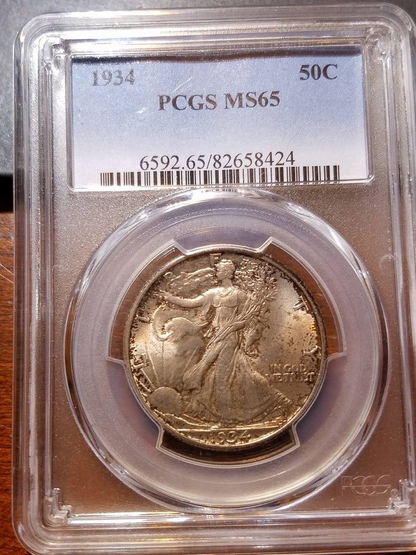 1934 Walking Liberty Half Dollar MS 65 PCGS Certified: 1934 Walking Liberty Half Dollar MS 65 PCGS Certified This 1934 Walking Liberty Half Dollar is a stunning example of American coinage, graded MS 65 by PCGS. It features the iconic Liberty Walking desi