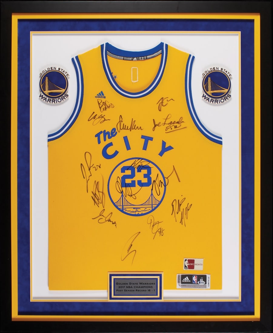 Golden State Warriors 2016-17 Champions Jersey Signed by Team Beckett Authenticated: Golden State Warriors 2016-17 Champions Jersey Signed by Team Beckett Authenticated This is a framed Golden State Warriors jersey from the 2016-17 NBA Championship season, featuring 14 signatures from