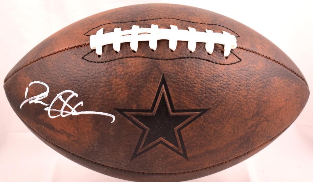 Deion Sanders Signed Dallas Cowboys Football Beckett Authenticated: Deion Sanders Signed Dallas Cowboys Football Beckett Authenticated This authentic football features the signature of Deion Sanders, an iconic player of the Dallas Cowboys. The ball showcases a distres
