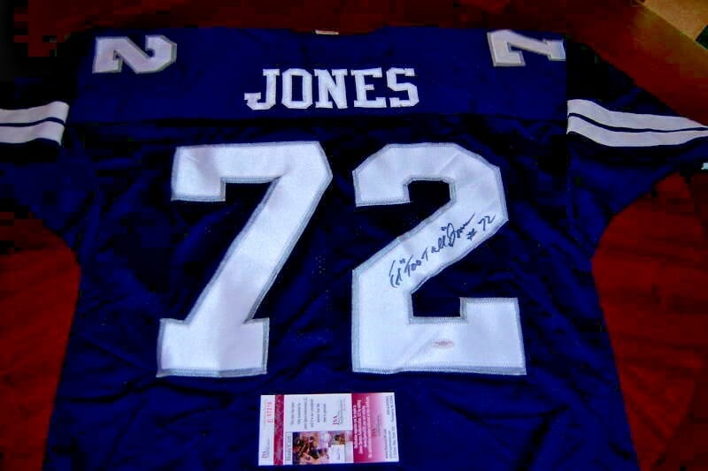 Ed Too Tall Jones Signed Dallas Cowboys Jersey with JSA COA: Ed Too Tall Jones Signed Dallas Cowboys Jersey with JSA COA This is an officially licensed Russell jersey signed by Ed Too Tall Jones, a distinguished player from the Dallas Cowboys. The jersey is an