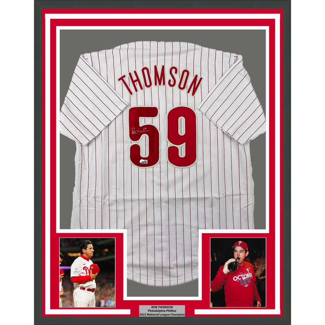 Framed Rob Thomson Autographed Pinstripe Jersey with Beckett COA: Framed Rob Thomson Autographed Pinstripe Jersey with Beckett COA Celebrate the legacy of Rob Thomson with this stunning framed autographed 33x42 pinstripe jersey. This original piece features a bold s