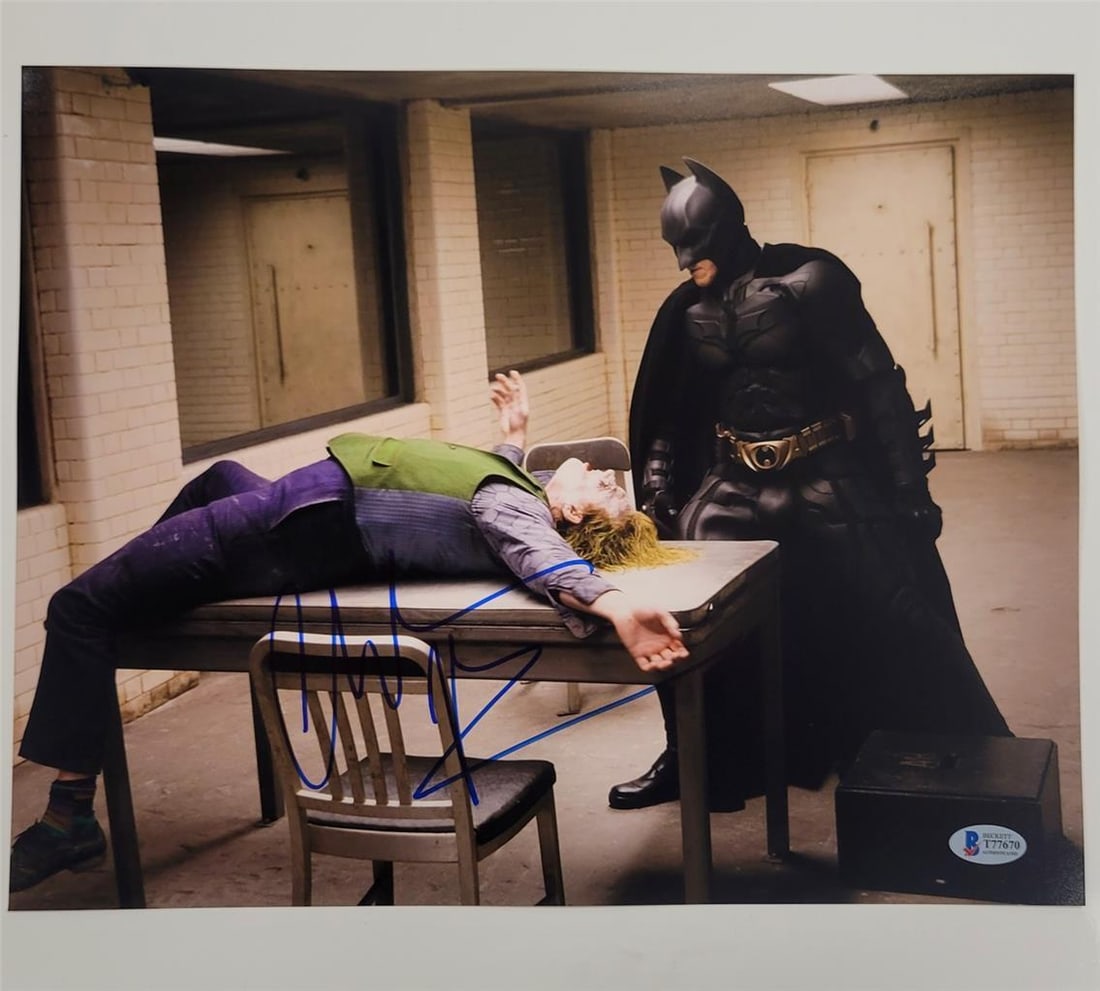 Christian Bale Signed 11x14 Batman Photo from The Dark Knight Beckett Authenticated: Christian Bale Signed 11x14 Batman Photo from The Dark Knight Beckett Authenticated This authentic 11x14 photograph features Christian Bale as Batman from the iconic film The Dark Knight. The photo is
