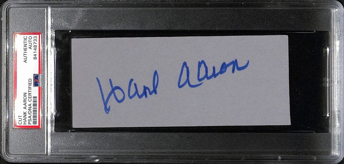 Hank Aaron HOF Autographed Cut Card 6x2.5 PSA/DNA Atlanta Braves: Hank Aaron HOF Autographed Cut Card 6x2.5 PSA/DNA Atlanta Braves This listing features a Hank Aaron Hall of Fame signed/autographed cut card measuring 6x2.5 inches, commemorating the legendary Atlanta