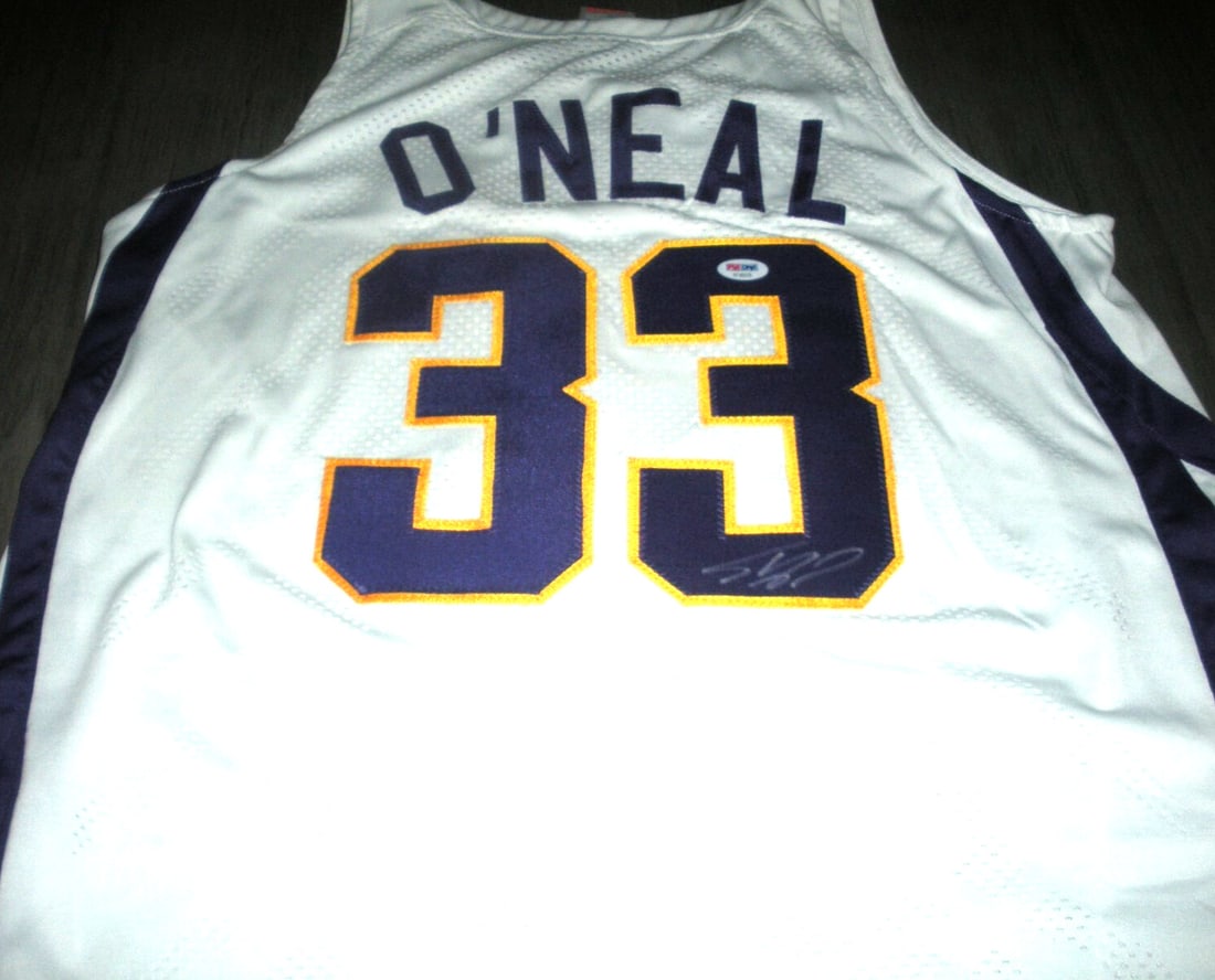 Shaquille O'Neal Signed LSU Tigers Nike Jersey with PSA/DNA COA: Shaquille O'Neal Signed LSU Tigers Nike Jersey with PSA/DNA COA This officially licensed Nike jersey features the iconic LSU Tigers design and is signed by basketball legend Shaquille O'Neal. As a tes