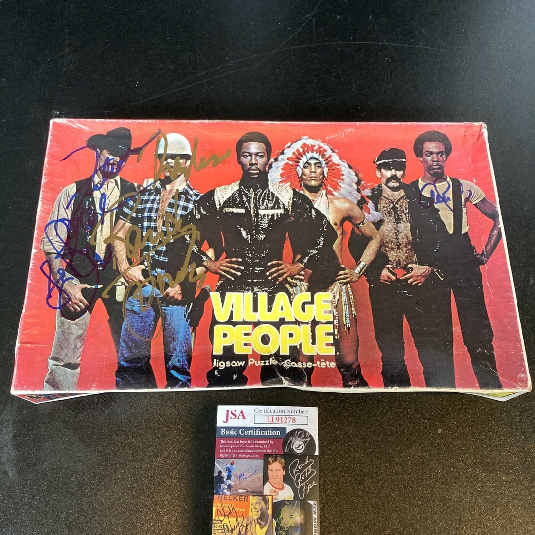Village People 1978 Signed Puzzle Randy Jones Felipe Rose Alex Briley JSA: Village People 1978 Signed Puzzle Randy Jones Felipe Rose Alex Briley JSA This is an original 1978 puzzle featuring the Village People band, autographed by members Randy Jones, Felipe Rose, and Alex B