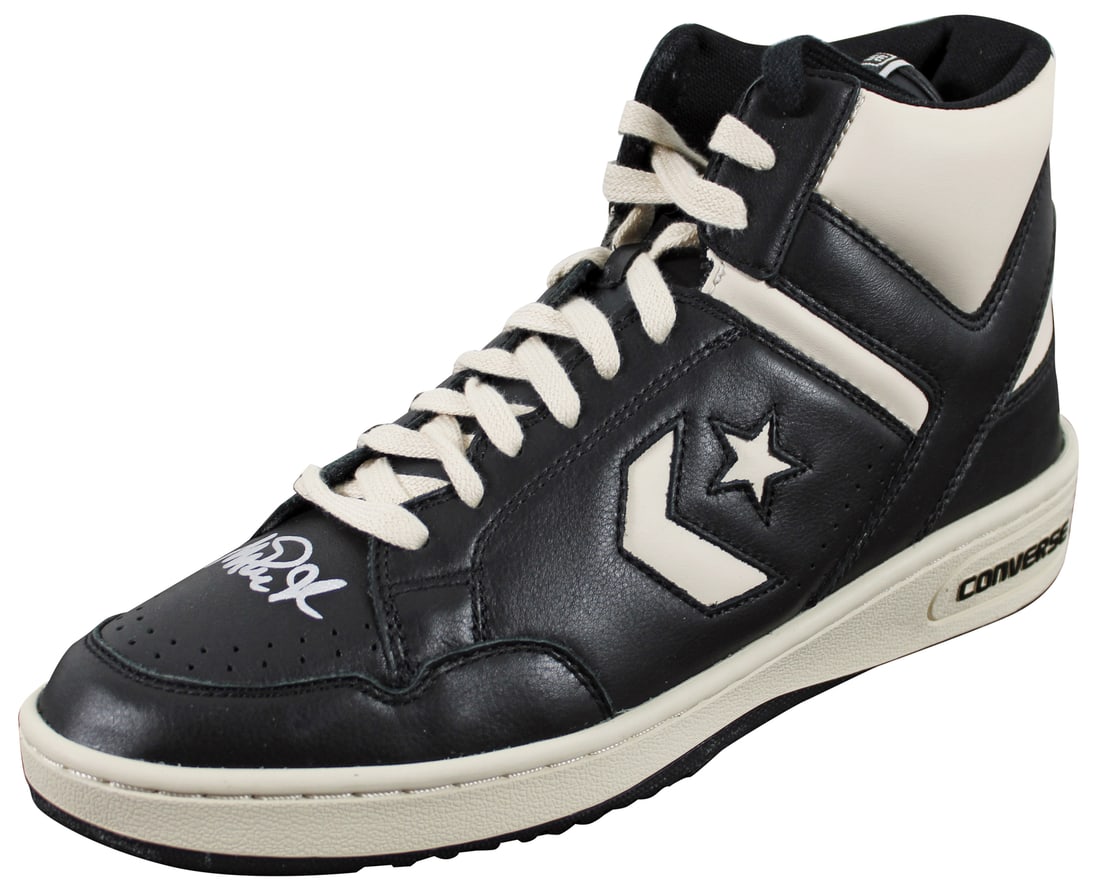 Magic Johnson Autographed Converse Weapon Shoe with Beckett COA: Magic Johnson Autographed Converse Weapon Shoe with Beckett COA This is a left black and white Converse Weapon shoe personally signed by Magic Johnson of the Los Angeles Lakers. The item is authentica