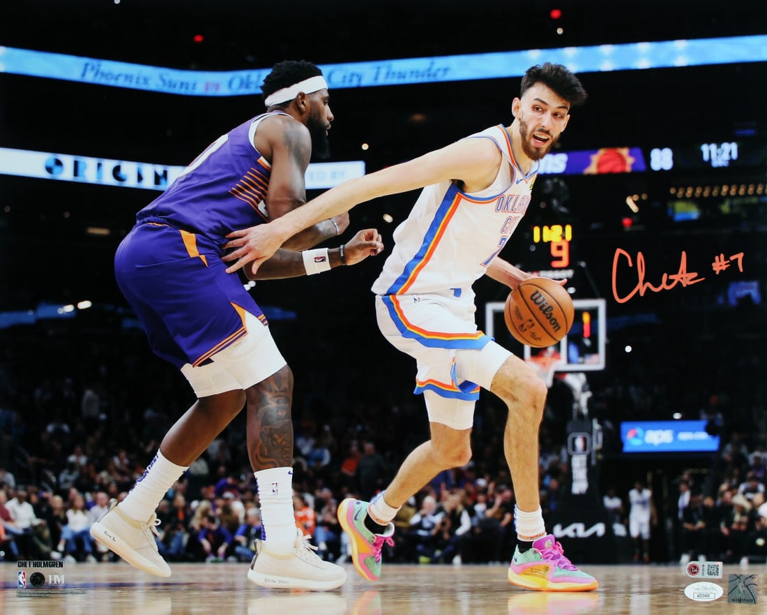 Chet Holmgren Autographed 16x20 Photo Oklahoma City Thunder vs Suns JSA COA: Chet Holmgren Autographed 16x20 Photo Oklahoma City Thunder vs Suns JSA COA This 16x20 horizontal photograph features Chet Holmgren of the Oklahoma City Thunder in action against the Phoenix Suns. The