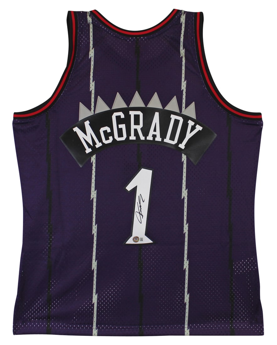 Tracy McGrady Signed Toronto Raptors Purple Swingman Jersey BAS Authenticated: Tracy McGrady Signed Toronto Raptors Purple Swingman Jersey BAS Authenticated Celebrate the legacy of Tracy McGrady with this authentic signed purple Mitchell & Ness Hardwood Classics Swingman jersey.