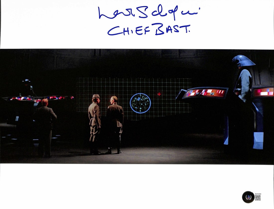 Autographed 11x14 Photo Leslie Schofield as Chief Bast Star Wars Beckett Authenticated: Autographed 11x14 Photo Leslie Schofield as Chief Bast Star Wars Beckett Authenticated This is an original 11x14 photograph autographed by Leslie Schofield, who portrayed Chief Bast in Star Wars: A Ne