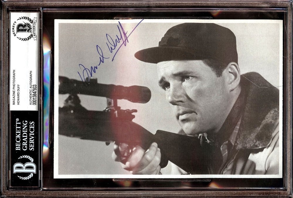 Howard Duff Autographed Magazine Photo Holding Rifle Beckett Authenticated 6 x 9: Howard Duff Autographed Magazine Photo Holding Rifle Beckett Authenticated 6 x 9 This is an original signed magazine photo of Howard Duff, authenticated by Beckett Authentication Services. The photogr