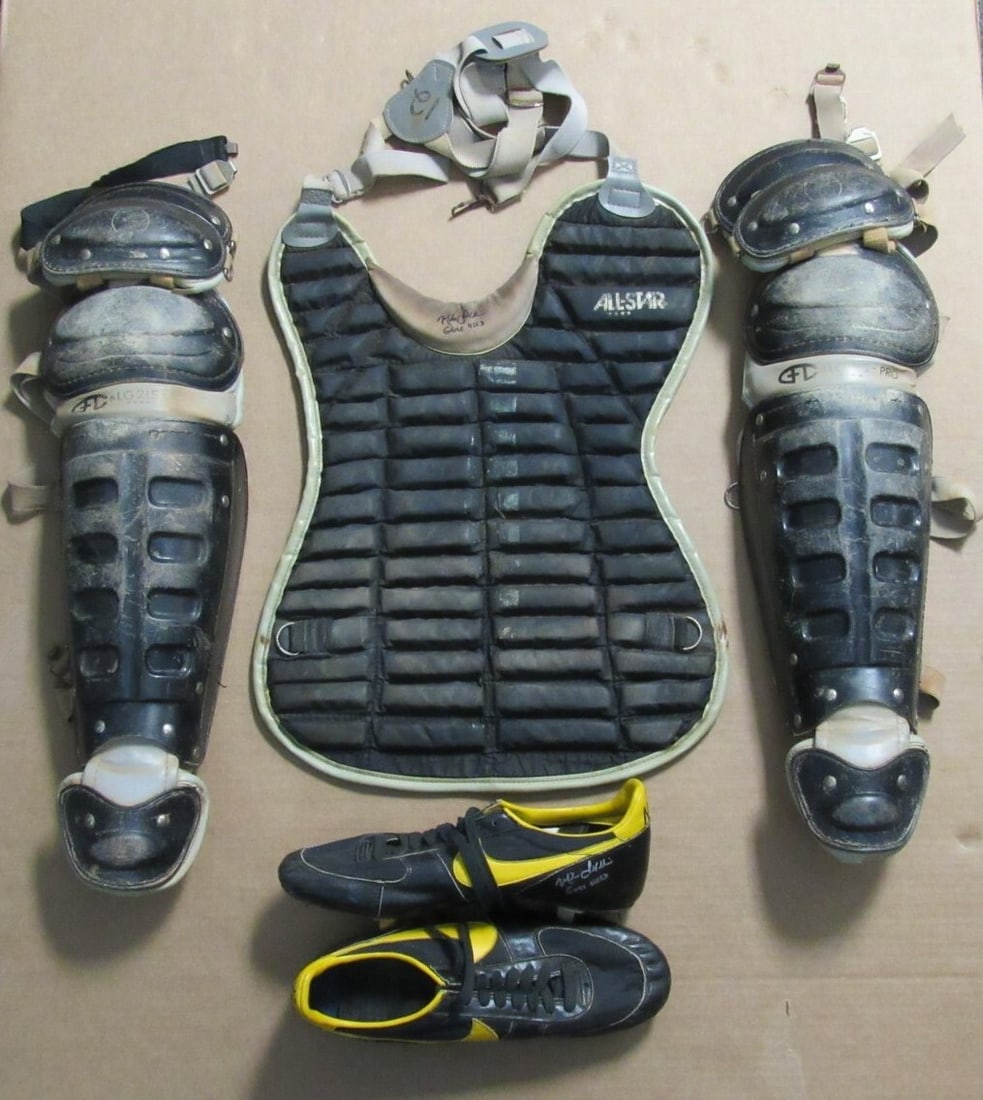 Mike LaValliere Signed Game-Used Catcher's Gear and Cleats Pirates 12: Mike LaValliere Signed Game-Used Catcher's Gear and Cleats Pirates 12 This is a Mike LaValliere Pittsburgh Pirates signed game-used catcher's gear and cleats set, featuring a chest protector, shin gua