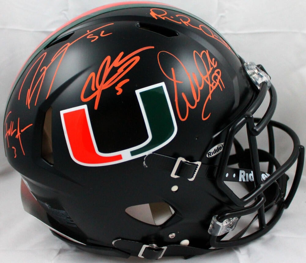 Miami Hurricanes Full Size Speed Helmet Signed by Sapp Irvin Johnson Lewis Gore Beckett: Miami Hurricanes Full Size Speed Helmet Signed by Sapp Irvin Johnson Lewis Gore Beckett This Miami Hurricanes Speed Authentic helmet features signatures from players Sapp, Irvin, Johnson, Lewis, and G