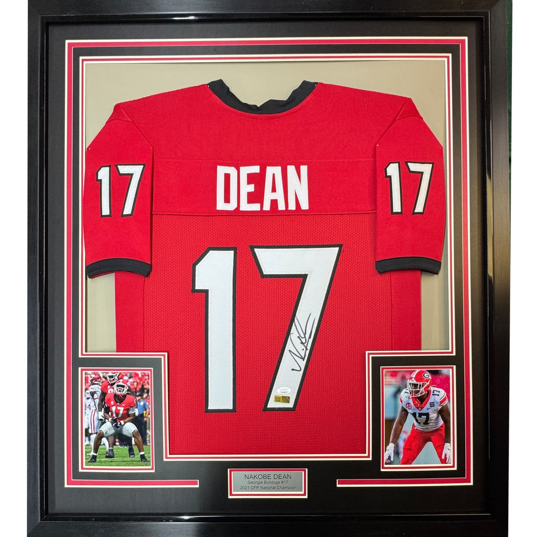 Framed Signed Nakobe Dean Georgia Bulldogs Jersey with JSA COA: Framed Signed Nakobe Dean Georgia Bulldogs Jersey with JSA COA Showcase your Georgia Bulldogs pride with this professionally framed and matted autographed jersey of Nakobe Dean. The vibrant red colleg