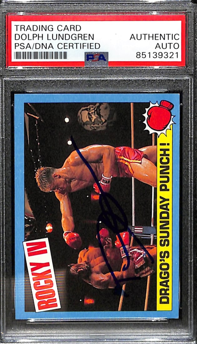 Dolph Lundgren Signed 1985 TOPPS Rocky IV Drago Card PSA/DNA #53: Dolph Lundgren Signed 1985 TOPPS Rocky IV Drago Card PSA/DNA #53 This is an original 1985 TOPPS Rocky IV Drago trading card #53, personally signed by Dolph Lundgren. The card showcases Lundgren as