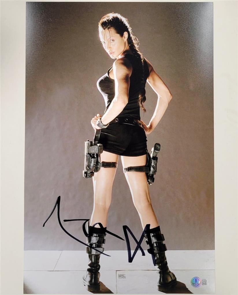 11x14 signed Angelina Jolie Lara Croft photograph with Beckett authentication: 11x14 signed Angelina Jolie Lara Croft photograph with Beckett authentication This is an original 11x17 photograph signed by Angelina Jolie as Lara Croft from Tomb Raider. The autograph has been authe