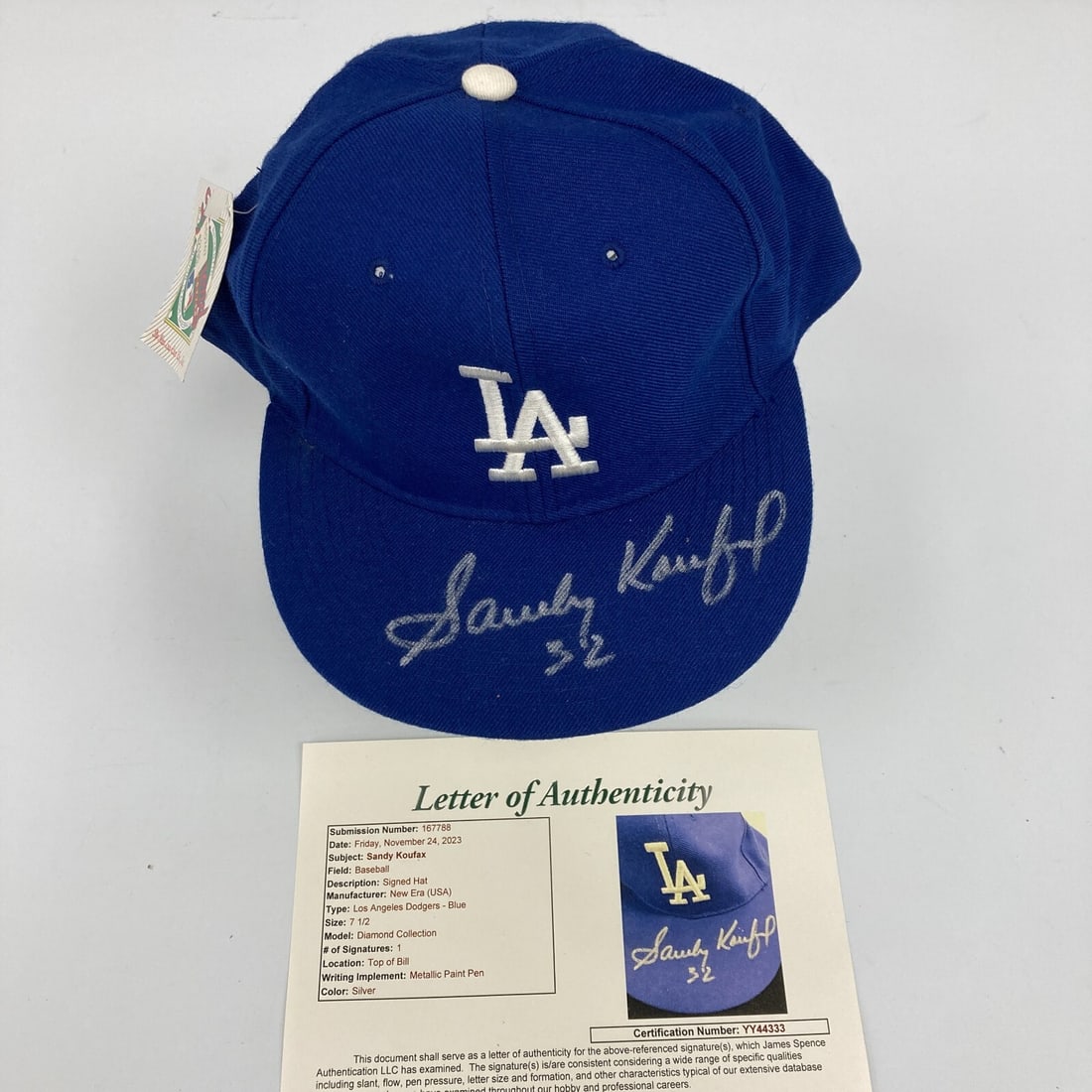 Sandy Koufax #32 Signed Brooklyn Dodgers Hat JSA Certified: Sandy Koufax #32 Signed Brooklyn Dodgers Hat JSA Certified This is a stunning Brooklyn Dodgers game model baseball hat, beautifully signed by legendary player Sandy Koufax. The hat, featuring a vibran