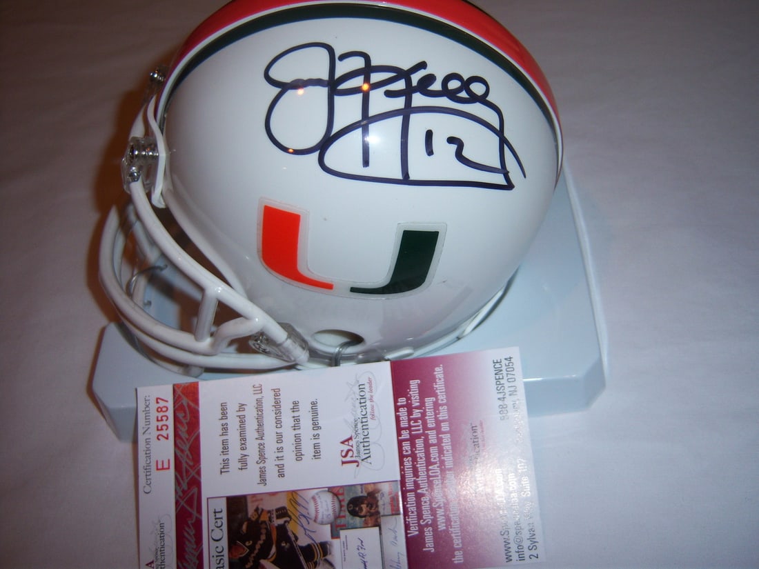 Autographed Jim Kelly Mini Football Helmet JSA COA Miami Hurricanes Buffalo Bills: Autographed Jim Kelly Mini Football Helmet JSA COA Miami Hurricanes Buffalo Bills This is a pre-owned mini helmet featuring the Miami Hurricanes and Buffalo Bills, signed by Jim Kelly. The helmet come