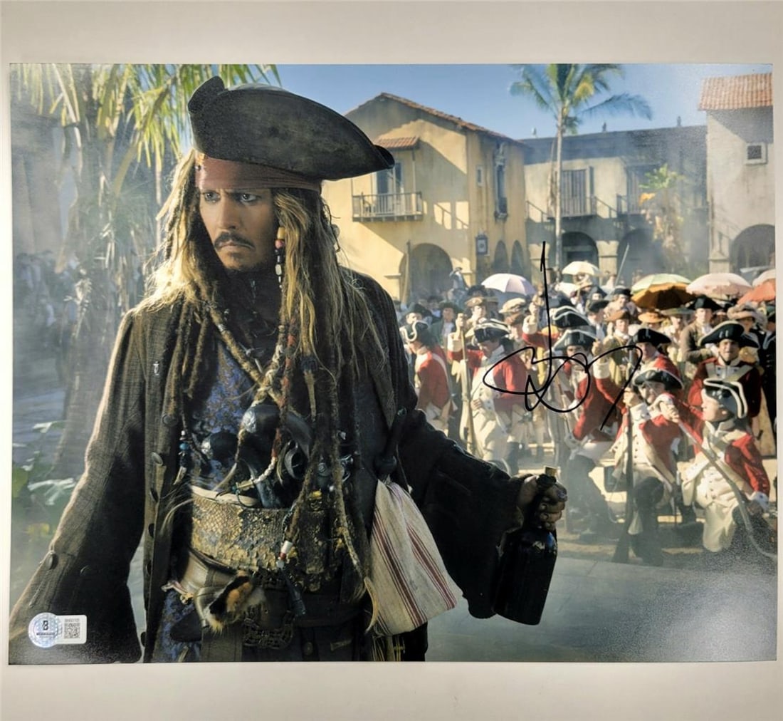 11x14 Pirates of the Caribbean Photo Signed by Johnny Depp Beckett Authenticated: 11x14 Pirates of the Caribbean Photo Signed by Johnny Depp Beckett Authenticated This is an original 11x14 photograph from Pirates of the Caribbean, personally signed by Johnny Depp. The autograph has