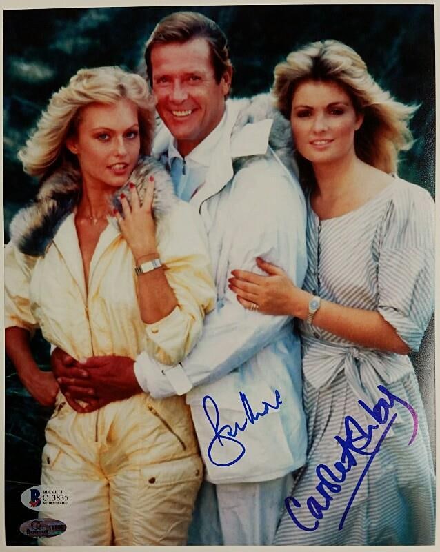 8x10 James Bond Photograph Signed by Roger Moore and Carole Ashby Beckett Authenticated: 8x10 James Bond Photograph Signed by Roger Moore and Carole Ashby Beckett Authenticated This is an original 8x10 photograph from the James Bond 007 series, hand-signed by Roger Moore and Carole Ashby.